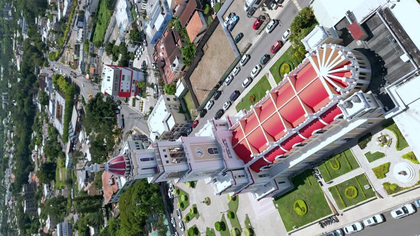 Sacred Heart of Jesus Church or Iglesia Sagrado Corazón De Jesus, Moca in Dominican Republic. Aerial orbiting and vertical format