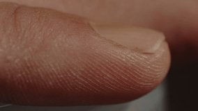Macro Close up of discolored man's fingernail on index finger - Powered by Shutterstock - Get 15% off with code: PIKWIZARD15