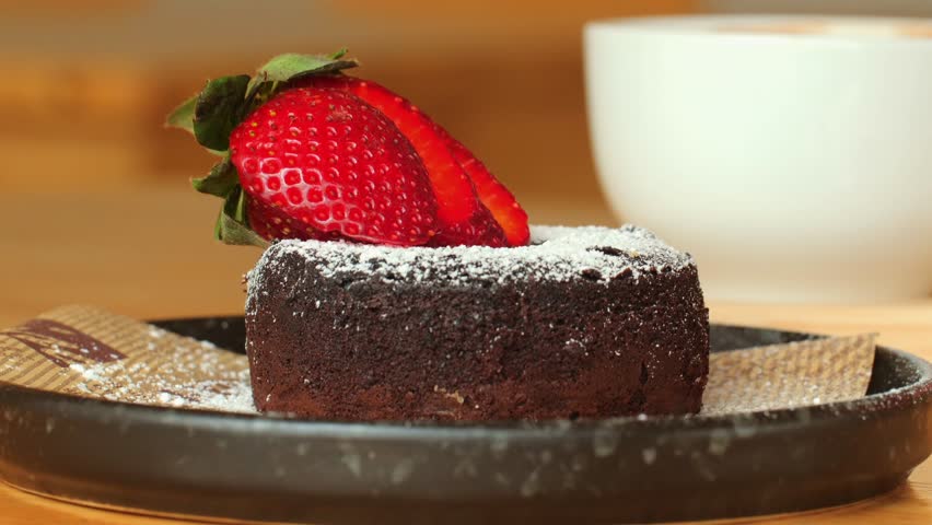 Chocolate Cake with Fresh Strawberry. Rich chocolate cake with a layer of fondant, garnished with fresh strawberries and sugar icing. Dark Chocolate Berry Pie