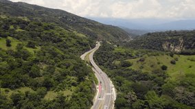 Aerial video over the road that leads from Medellín to Santa Fe de Antioquia, in areas that belong to the municipality of San Jeronimo
