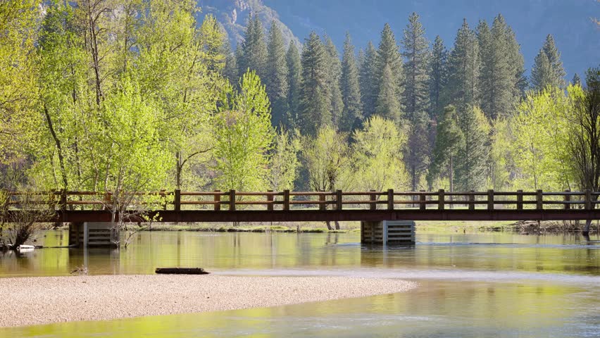 Swinging Bridge over the Merced River as it runs through Yosemite National Park in California.