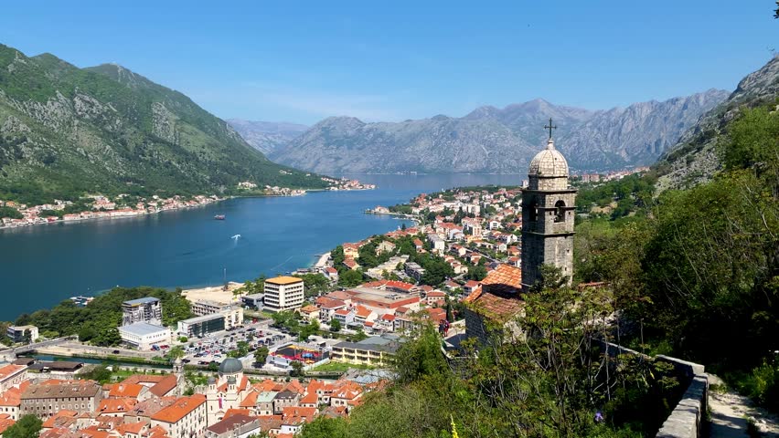 Aerial view of the old town of Kotor, Montenegro. Bay of Kotor bay is one of the most beautiful places on Adriatic Sea. Historical Kotor Old town and the Kotor bay of Adriatic sea, Montenegro. Royalty-Free Stock Footage #1109093771