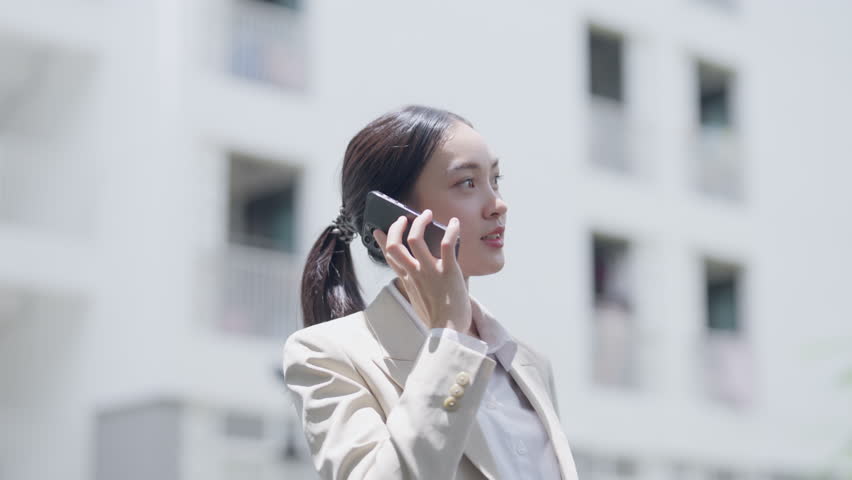 Business woman using smartphone outdoors in city
 | Shutterstock HD Video #1109096929