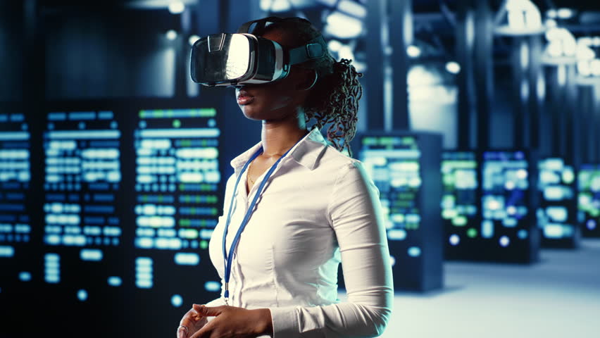 African american experienced specialist immersed in virtual reality at data center, doing units maintenance. Adept professional using VR headset to optimize servers performance, checking operations Royalty-Free Stock Footage #1109098447