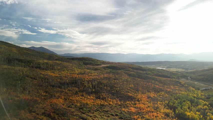 Wide aerial above colorful rolling mountains in fall near Basalt Colorado