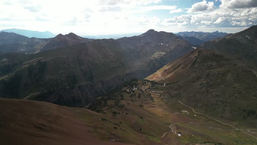 High aerial of Slate River Road and Elk Mountains in Crested Butte Colorado at high elevation in fall