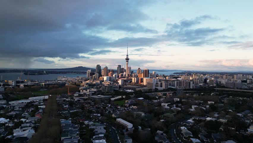 Auckland, New Zealand: Aerial drone footage of Auckland downtown district skyline view from Ponsonby residential district in New Zealand largest city with a dramatic sky in late afternoon Royalty-Free Stock Footage #1109103731