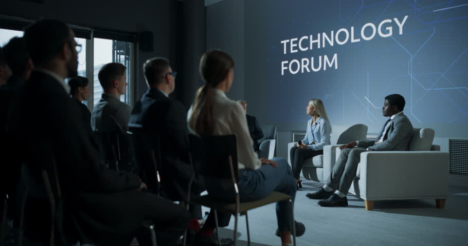 International Technology Conference: Host Asking Caucasian Female Tech CEO a Question In Front Of Audience. Successful Woman Delivering Inspirational Speech And Diverse Attendees Applaudding Her. Royalty-Free Stock Footage #1109115181