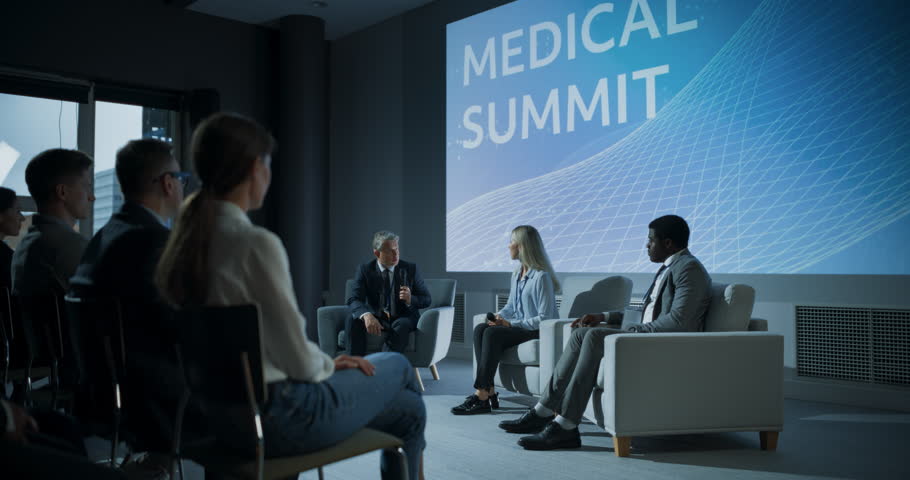 International Medical Summit: Host Asking Caucasian Female Pharmaceutical CEO a Question In Front Of Audience Of Diverse Attendees. Woman Talking About New Developments In Biotechnology, Medicine. Royalty-Free Stock Footage #1109116043