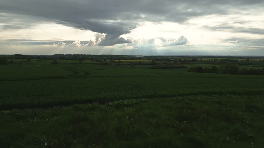 Old windmill in a field back flight 