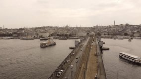 close up Drone video of galata bridge with ships ferryboats and istanbul view