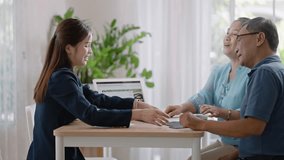 Financial advisor,realtor agent,insurance,lawyer,Manage your retirement fund concept.Financial advisor showing presentation on computer,deal shake hand to happiness Elderly asian couple retirement - Powered by Shutterstock - Get 15% off with code: PIKWIZARD15