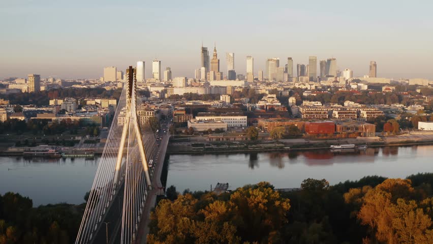 Establishing aerial panoramic drone view Warsaw city cityscape. Swietokrzyski bridge over Wisla river, skyscrapers downtown urban skyline, early morning. Cinematic shot high rise buildings on horizon