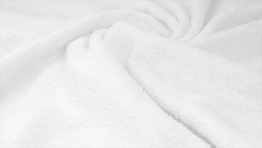 Towel texture closeup. Soft white color cotton towel backdrop, fabric background. Terry cloth bath or beach towels. Macro. Slow motion.  Royalty-Free Stock Footage #1109143999