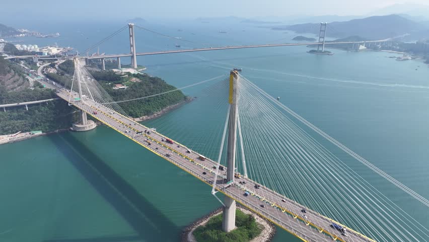 Drone Aerial Skyview in Highway Flyover Traffic on Ma Wan Sham Tseng Tsuen Wan Tsing Yi Tuen Mun Road Hong Kong Tsing Ma suspension Bridge, Ting Kau bridge Royalty-Free Stock Footage #1109148001