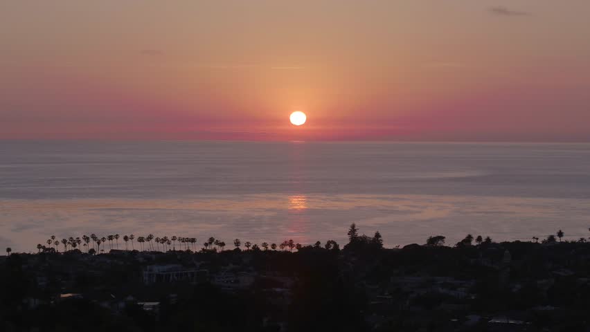 Drone footage over the neighborhoods of La Jolla San Diego California Durning Sunset