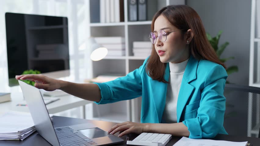 Tired businesswoman, sleepy, bored, headache, eyestrain, and office syndrome. feeling sick at work.