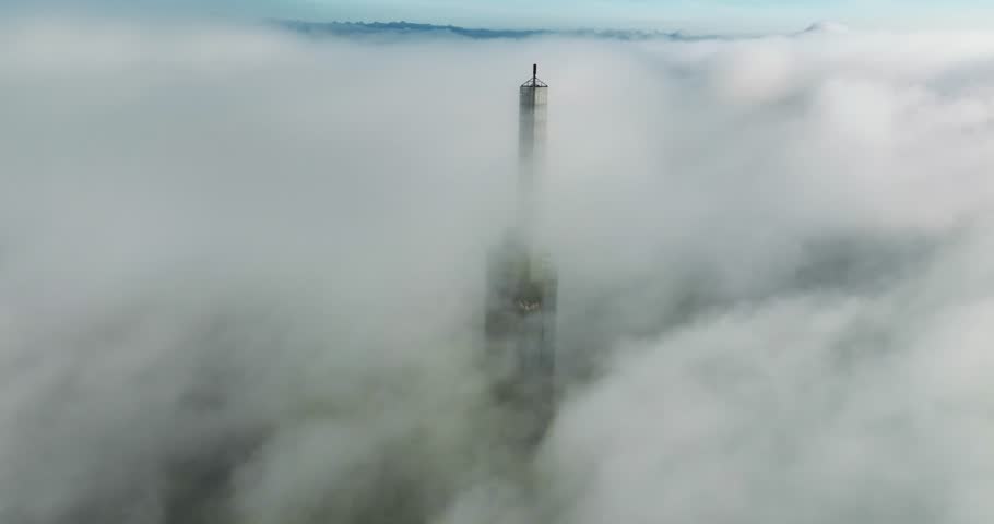 Aerial view of the top of the tallest skyscraper in Ho Chi Minh City on a foggy winter day. Cityscape in Ho Chi Minh City, Vietnam