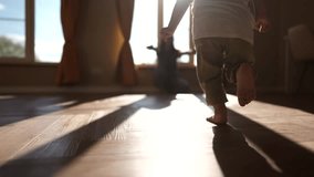 baby baby first steps. happy family kid dream concept. child runs barefoot to mom hugs at home indoors hugs joy. baby runs lifestyle to mom first steps on the floor indoors - Powered by Shutterstock - Get 15% off with code: PIKWIZARD15