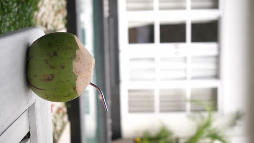 Green coconut on the deck chair near the swimming pool. High quality 4k footage | Shutterstock HD Video #1109166931