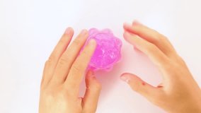 Pink slime in a transparent box. ASMR video with pink slime.