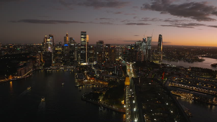 Sydney Harbor Bridge and Downtown Sydney City Skyline, Australia, Sunset, Beautiful Colorful Afterglow, Evening, Wide Cinematic Establishing Aerial  Royalty-Free Stock Footage #1109167549