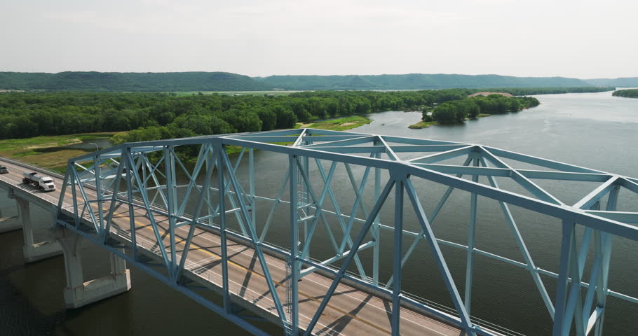 Cars Driving Through The Wabasha-Nelson Truss Bridge Spanning The Mississippi River In Minnesota, USA. - aerial Royalty-Free Stock Footage #1109169865