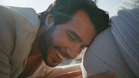 Happy man kissing belly unknown pregnant wife sitting nature closeup. Caring handsome husband caressing woman big tummy gently feeling love. Smiling loving future father enjoy pregnancy expecting baby - Powered by Shutterstock - Get 15% off with code: PIKWIZARD15