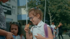 Loving family. Caring mother meets her daughter from school. Mother hugging her daughter with backpack after school classes. Back to school. - Powered by Shutterstock - Get 15% off with code: PIKWIZARD15