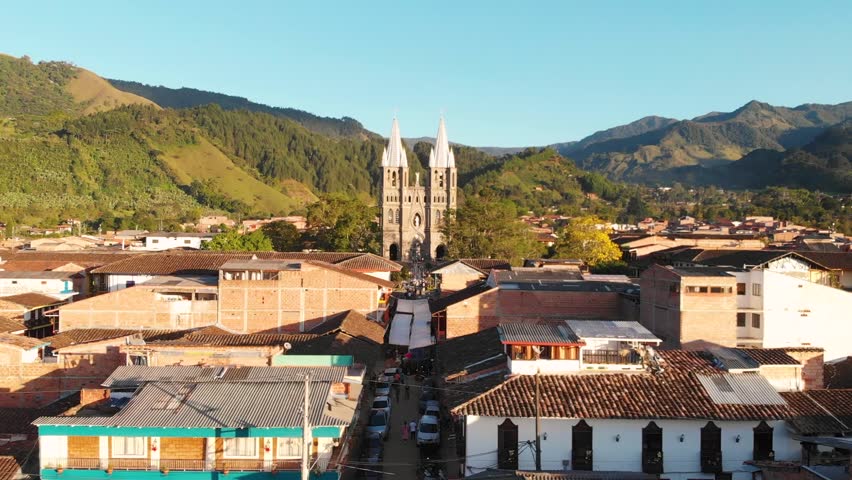 Basilica of the Immaculate Conception Catholic Church Over the Small Town of Jardin with a Low Aerial Dolly in Columbia.