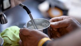 Milk frothprocess of barista working at the cafe.
Barista whips milk in a pitcher with hot steam from coffee machine. process of making milk foam. - Powered by Shutterstock - Get 15% off with code: PIKWIZARD15