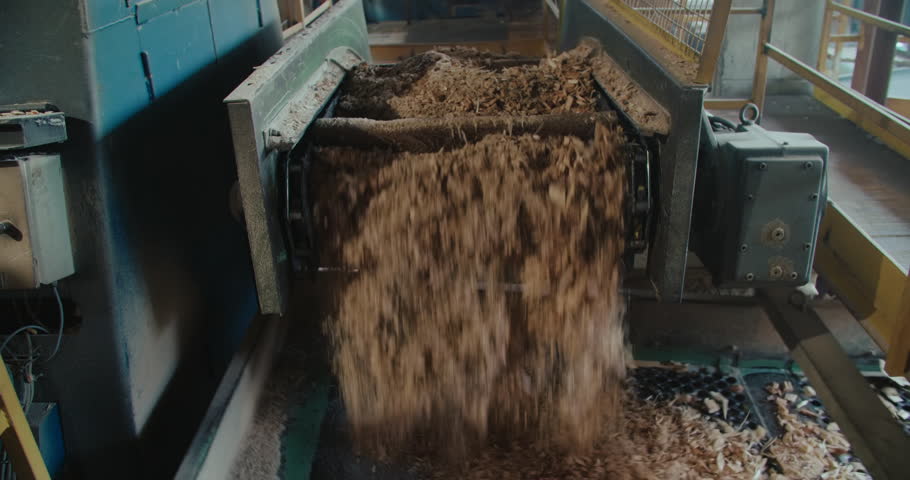 Recycling and reusing of timber industry wastes. sawdust on sorting conveyor belt  Royalty-Free Stock Footage #1109181319