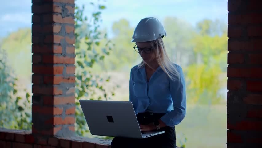 Engineer in hard hat working on building site | Shutterstock HD Video #1109183389