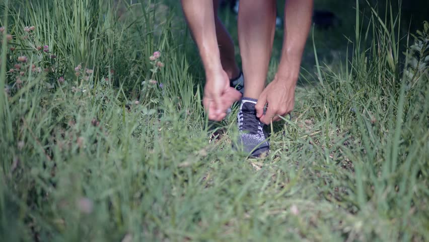 Runner tying shoelace on sport shoes | Shutterstock HD Video #1109183401