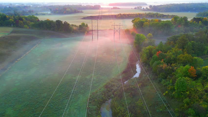 Amazing arial view of Autumn foggy landscape with power grid utility poles.
 Royalty-Free Stock Footage #1109189447