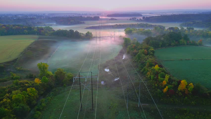 Amazing arial view of Autumn foggy landscape with power grid utility poles.
 Royalty-Free Stock Footage #1109189449