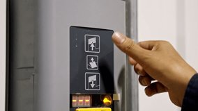 Worker Pushing Button Opening Loading Dock Bay Door in Distribution Warehouse. 4k 50fps - Powered by Shutterstock - Get 15% off with code: PIKWIZARD15