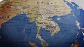 Atlas map of the world globe spinning zooming in and focusing on the country of Thailand, Thai. Showing area, motion video stock in HD and 4K 