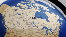 Atlas map of the world globe spinning zooming in and focusing on the country of Canada, canadian. Showing area, motion video stock in HD and 4K 
