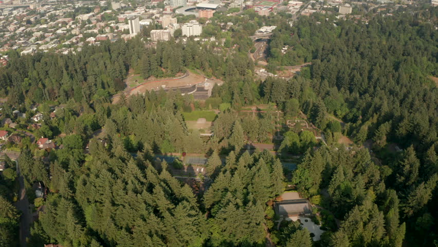 Pan up reveal aerial shot of Portland Oregon from forest park