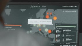 Global cyber attack with world map on computer screen, Europe and Russia on map. Internet network communication under cyberattack. Worldwide propagation of virus online. Closeup. - Powered by Shutterstock - Get 15% off with code: PIKWIZARD15