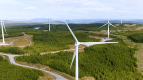 Connemara aerial landscape with wind turbines of Galway Wind Park located in Cloosh Valley, County Galway. Largest onshore wind farm in Ireland, green energy generation. Galway Wind Way recreation. - Powered by Shutterstock - Get 15% off with code: PIKWIZARD15