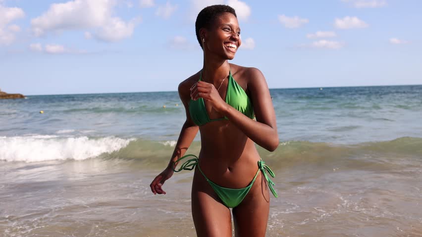 Beautiful young black skin woman in a bikini lying on the beach on a beach  towel. Generative AI 29353977 Stock Photo at Vecteezy
