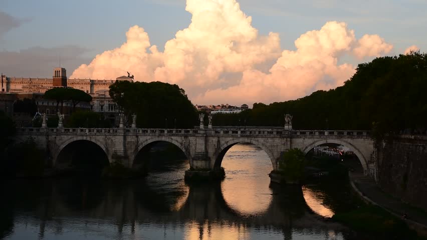 Tiber river, Sant'Angelo Bridge and cumulonimbus clouds at sunset in Rome, Italy | Shutterstock HD Video #1109208005