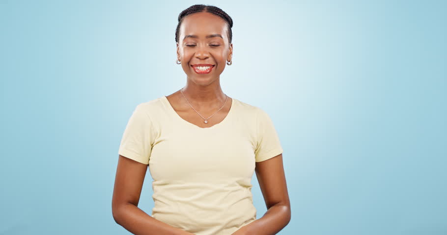 Woman, dance and success with fist in studio to celebrate deal, promotion or winning lotto prize on blue background. Portrait of excited african model, winner and yes for bonus, competition or reward