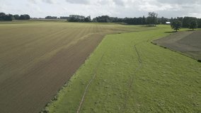 Drone aerial video footage agriculture farms in the countryside of northwest France. 