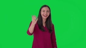 Happy Indian woman pointing and calling someone Green screen - Powered by Shutterstock - Get 15% off with code: PIKWIZARD15