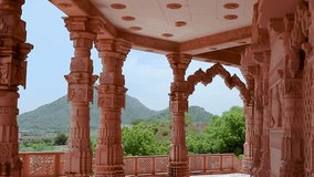 artistic hand carved red stone jain temple at morning from unique angle video is taken at Shri Digamber Jain Gyanoday Tirth Kshetra, Nareli Jain Mandir, Ajmer, Rajasthan, India.