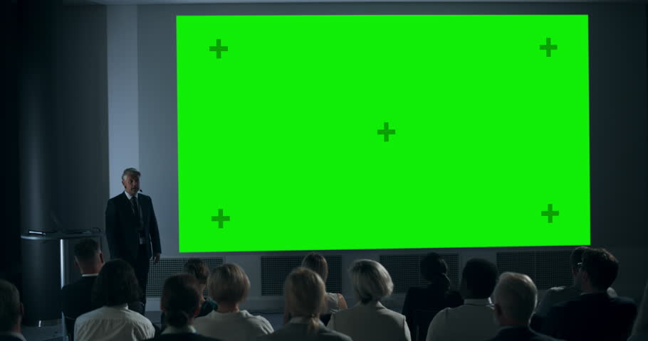 Corporate Event: Caucasian Male Tech CEO Giving Presentation On Green Screen Chromakey Projector Display To Colleagues In Conference Room Of Startup Office. Man Talking About Business Profits. | Shutterstock HD Video #1109215793