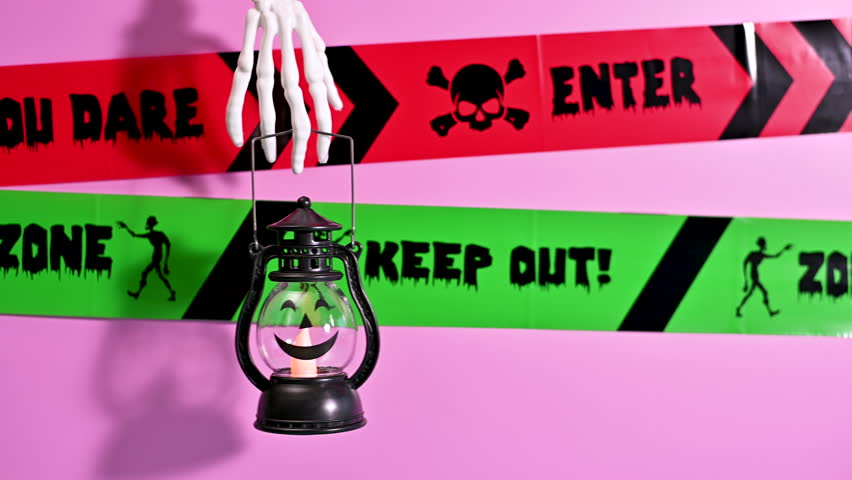 Creative Pastel Halloween Background: Skeleton Hand hold Lantern